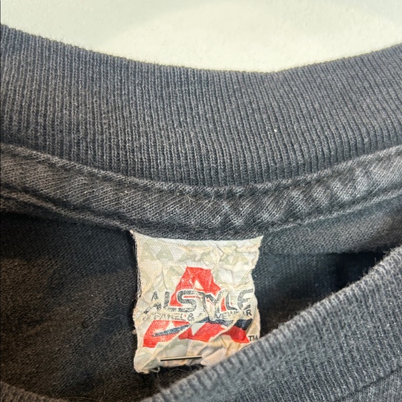 Typo Negative Black Sleeveless Graphic Tee with Green Triangle - Picture 2 of 3